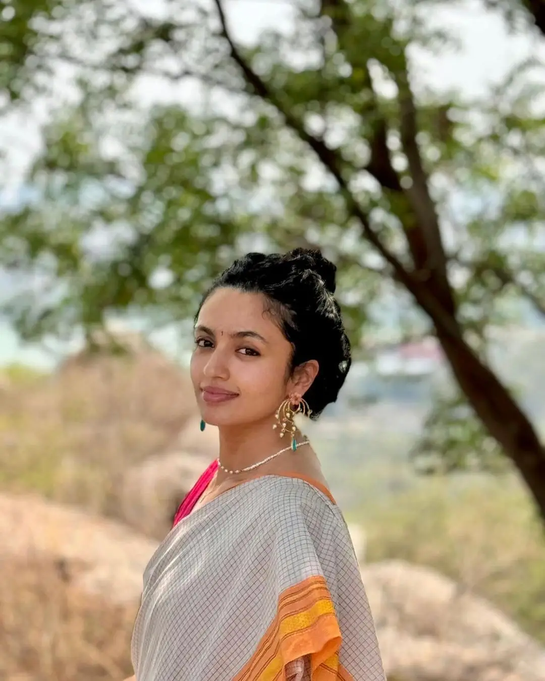 Malvika Nair in White Saree Sleeveless Red Blouse